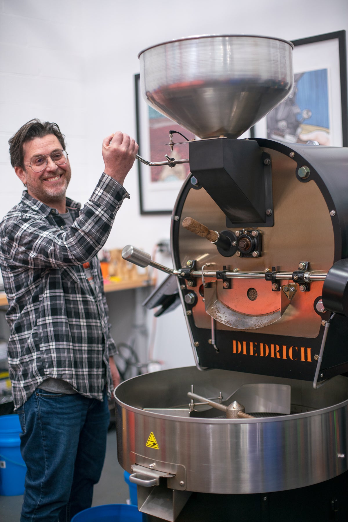 Fireside Coffee Co. team member hand-roasting coffee beans